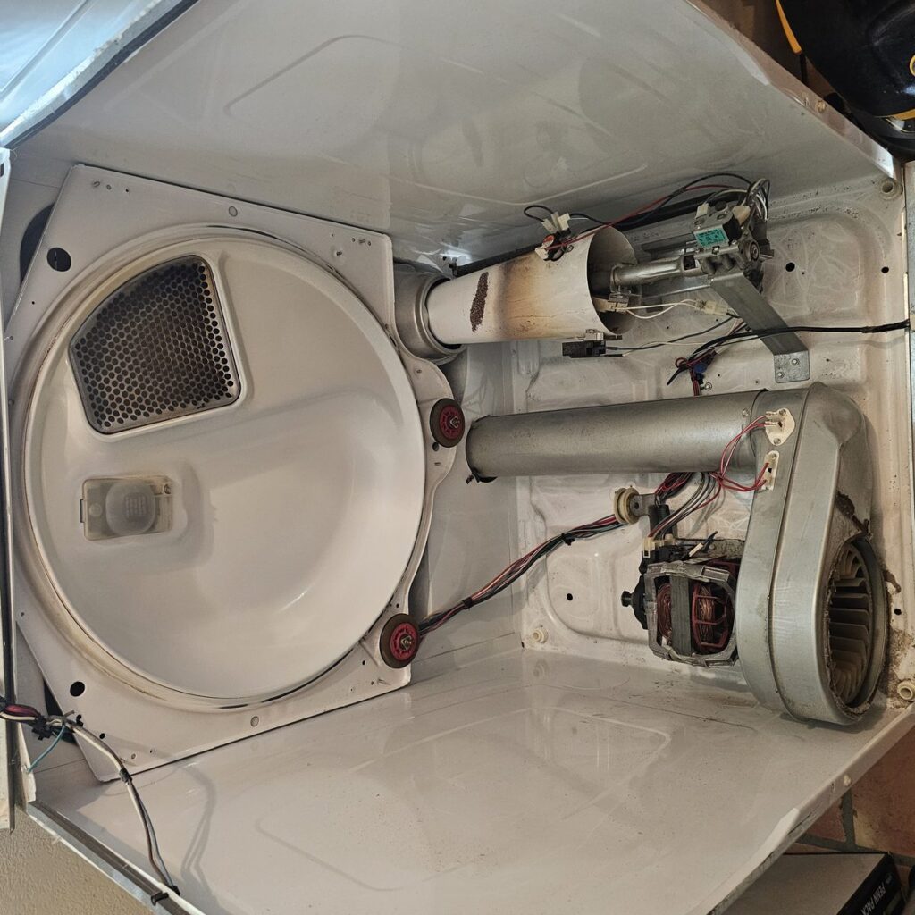 The full heating circuit: drive motor and blower at left, heating element housing at right, thermostats mounted along both.