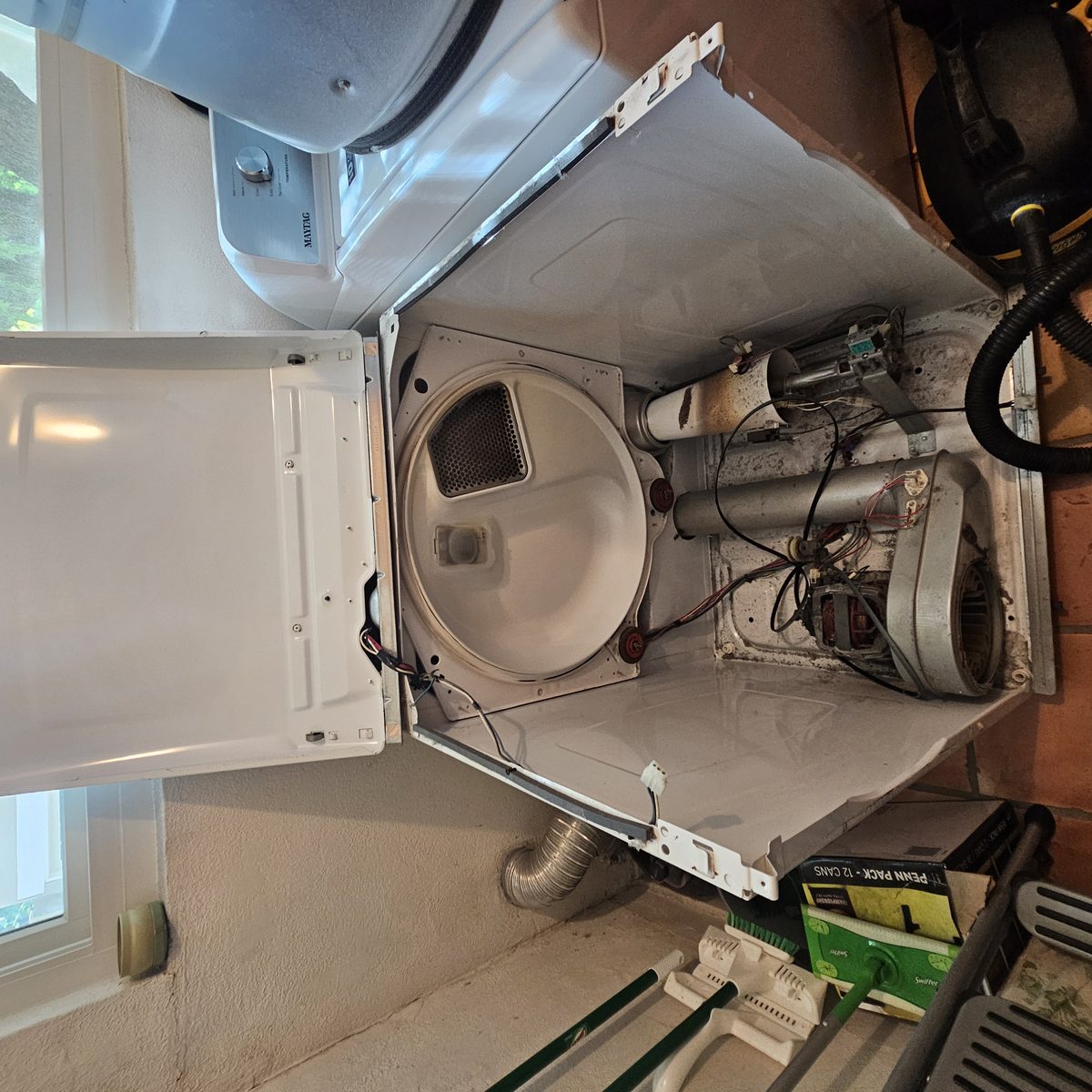Maytag Bravos dryer opened for no-heat diagnosis in a Los Angeles laundry room
