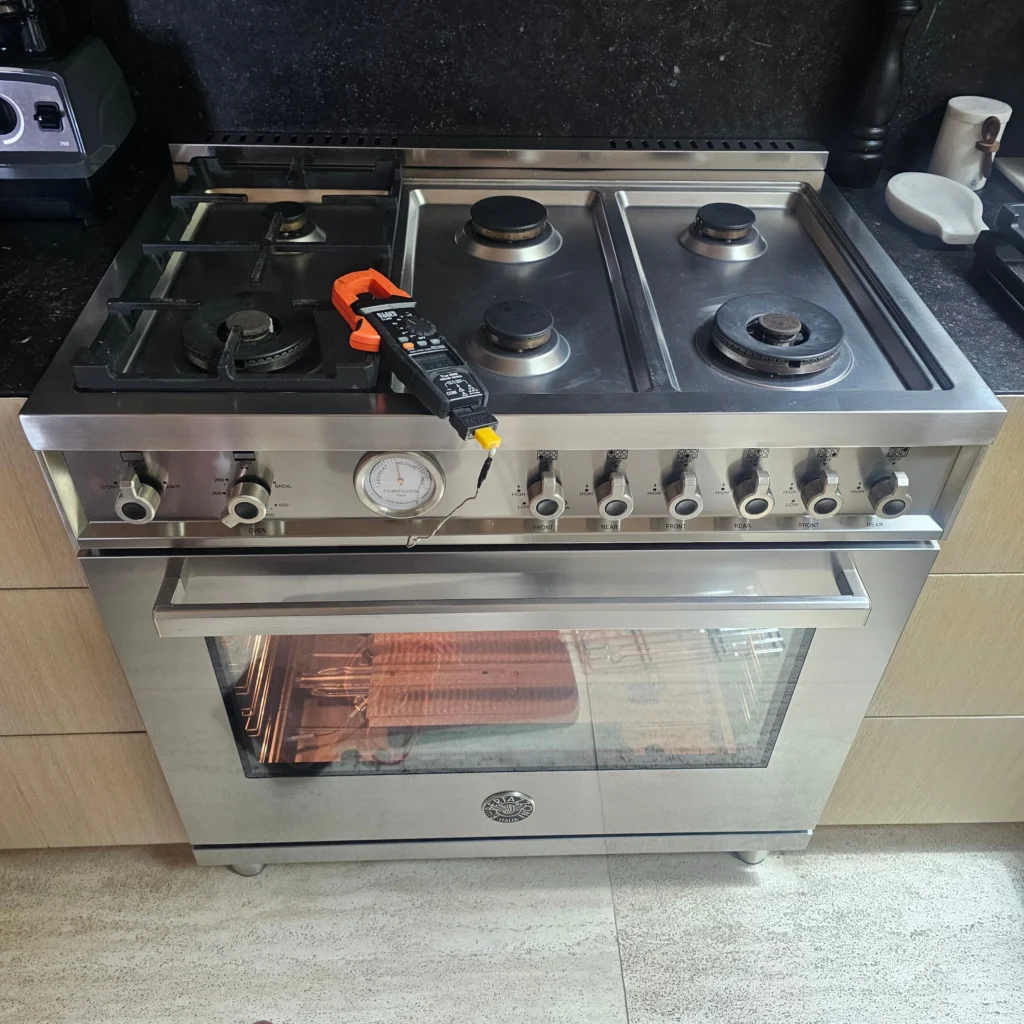 CityFix Appliance technician performing a diagnostic test on a Bertazzoni range to resolve a Bertazzoni oven not heating issue.