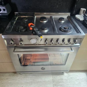 CityFix Appliance technician performing a diagnostic test on a Bertazzoni range to resolve a Bertazzoni oven not heating issue.