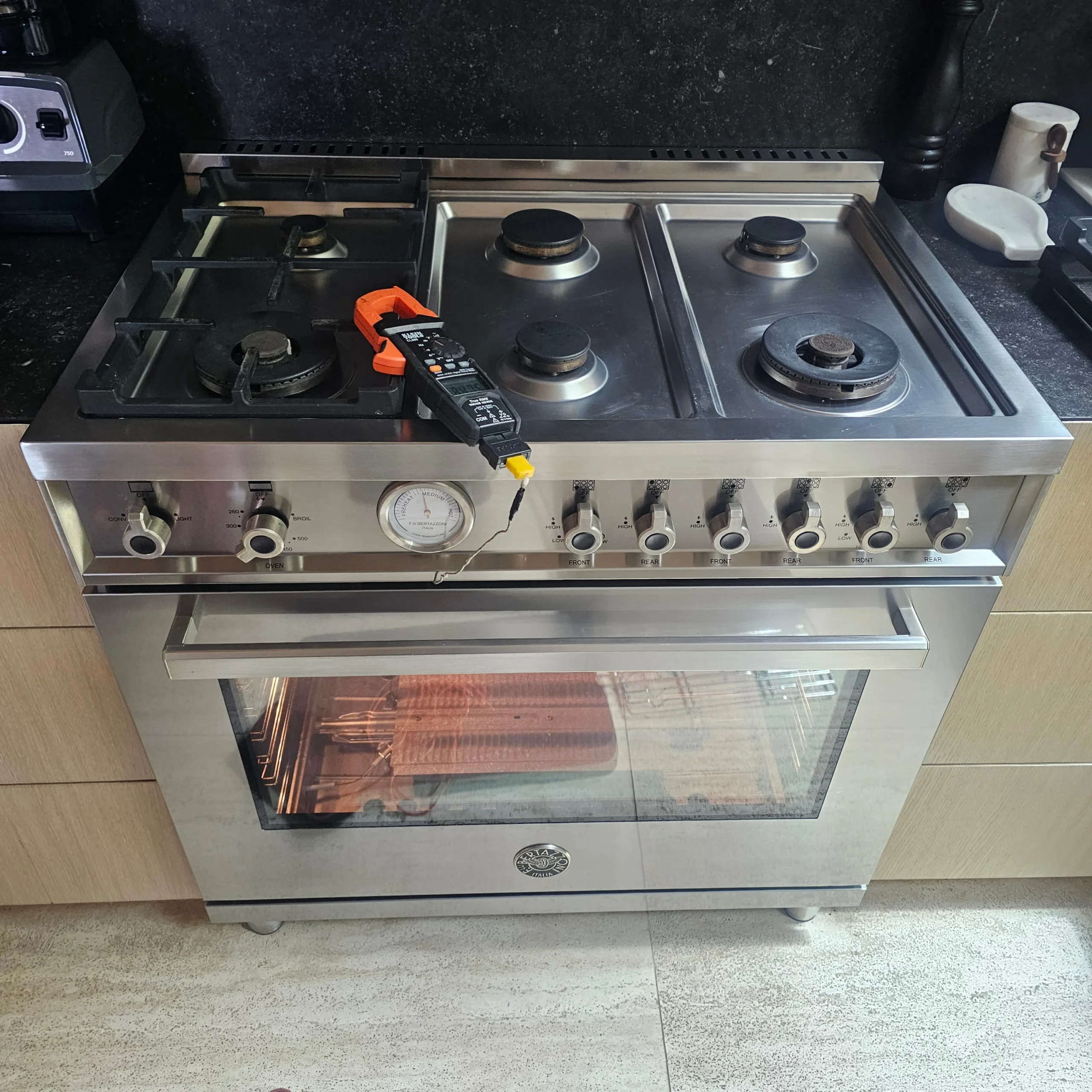 CityFix Appliance technician performing a diagnostic test on a Bertazzoni range to resolve a Bertazzoni oven not heating issue.