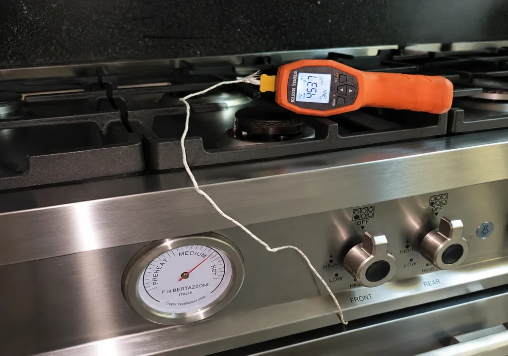 Bertazzoni Oven Not Heating? Complete Diagnostic Guide 1 Digital thermometer verifying Bertazzoni oven temperature against factory gauge
