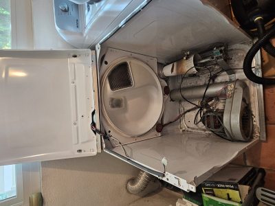 Maytag Bravos dryer opened for no-heat diagnosis in a Los Angeles laundry room